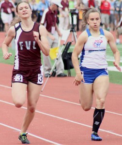 Waupaca's Tatiana Sotka (right) runs alongside another Eastern Valley Conference runner, Fox Valley Lutheran's Mary Kolell, during a 200-meter dash preliminary heat race at last year's WIAA State Track & Field Meet in La Crosse. The Comets and Foxes have a new conference this season, as Waupaca and FVL will now compete in the North Eastern Conference with Clintonville, Oconto Falls, Marinette, Little Chute, Freedom, Denmark, Wrightstown and Luxemburg-Casco. Greg Seubert Photo