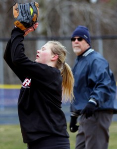 Manawa's Lesley Wilz squeezes her glove on the ball for an out against Iola-Scandinavia.  Holly Neumann Photo
