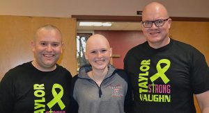 Andy Behrendt (left) and Bryan Robertson (right), pastors at Trinity Lutheran Church in Waupaca, shaved their heads in May to show their support for church member Taylor Vaughn, who was diagnosed with non-Hodgkin's lymphoma in March. Photo from Rich Vaughn's Facebook page