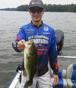 Steve Niemi shows off a largemouth bass he caught during a fishing tournament. The Iola-Scandinavia High School senior is one of two Wisconsin anglers named to the Bassmaster High School All-State Team.  Submitted Photo