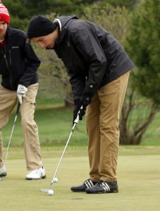 Jon Bauer concentrates while putting for Iola-Scandinavia during a recent match at Glacier Wood Golf Club. Holly Neumann Photo
