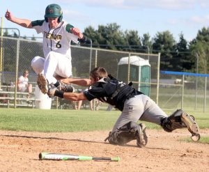 Waupaca catcher Hayden Neidert tags Freedom's Parker Rudie out at home plate June 1 during a WIAA Division 2 regional final at Waupaca High School. Greg Seubert Photo  CLICK IMAGE TO ENLARGE