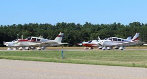 Piper Cherokee pilots are ready to head into the sky above Waupaca Municipal Airport on Friday, July 22. They did a mass fly over and missing man formation in honor of the late Peter Andersen. Angie Landsverk Photo
