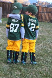 Twin brothers Desmond (left) and Christian Abel of Pray, Montana, will be featured on the ticket for the Green Bay Packers' Dec. 24 game against the Minnesota Vikings at Lambeau Field. The boys' mother, Staci, entered this photo in the Packers' Ticket Takeover Contest. The photo received the most online votes among five finalists. Abel is the daughter of Larry and Pat Krebs of Waupaca. Photo Courtesy of Staci Abel
