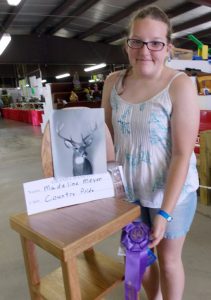 Madeline Meyer won grand champion in woodworking with a deer pedastal. Jane Myhra Photo