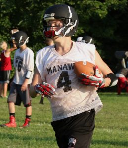 Isaac Ratliff brings the ball up the field while practicing with the Manawa football team. Holly Neumann Photo
