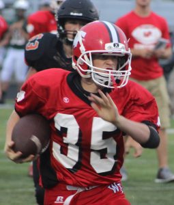 Zarek Hoffman carries the ball for Weyauwega-Fremont as the Indians' offense matched up against Clintonville's defense at a scrimmage in Ripon. Greg Seubert Photo