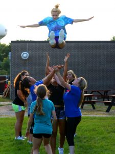 Joliene Denton flies through the air while practicing with the Manawa Wolves cheer squad. The team performs during Manawa football games.  Holly Neumann Photo