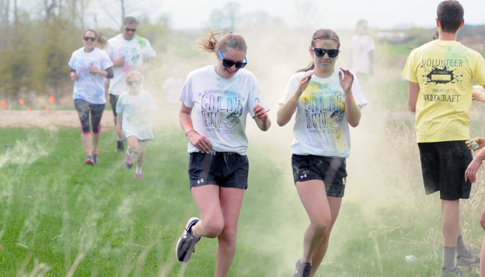 Color Runners power through a cloud of yellow.Scott Bellile photo
