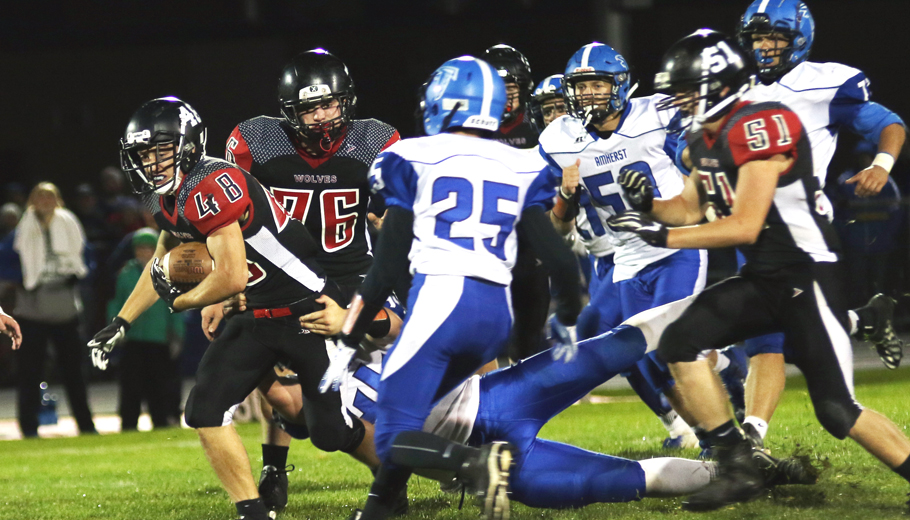 Seth Forbes picks up a first down for the Wolves. Holly Neumann Photo