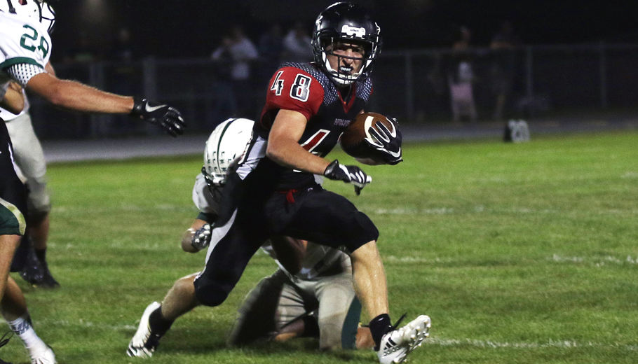 Seth Forbes picks up a 1st down for the Manawa Wolves.Holly Neumann photo.