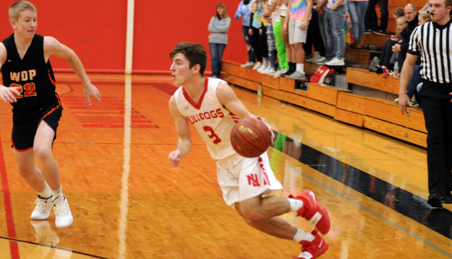 Garret Locy drives to the hoop during the first half. Erik Buchinger photo