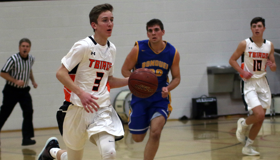 Parker Prahl brings the ball up the court for the T-Birds.Holly Neumann Photo