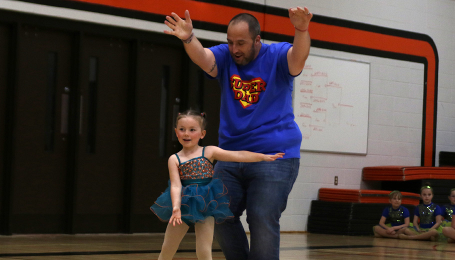 Troy Nielson dances with his daughter Eva.Holly Neumann photo.