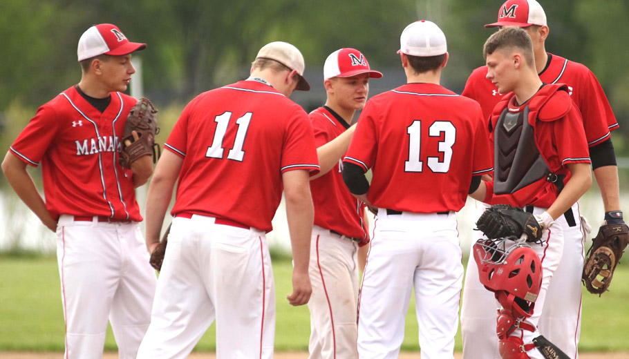 Manawa players talk things over on the mound.Holly Neumann Photo