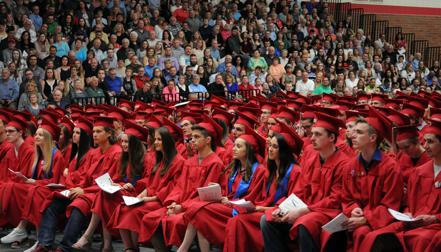 Graduates listen in on the valedictorian speeches. Erik Buchinger photo