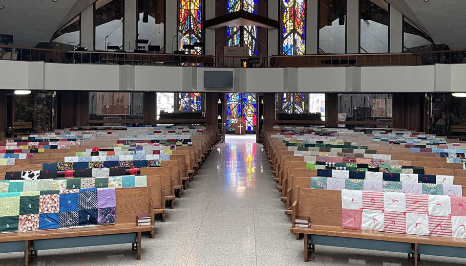 Church makes quilts for refugees