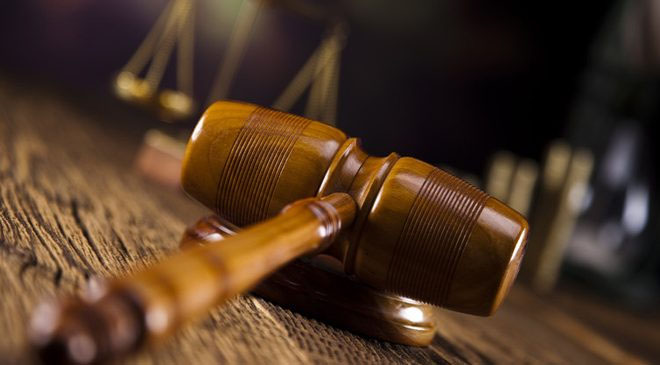 Judge dismisses charges against Iola couple